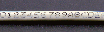 ケーブル印字(黒色印字、470m/分)
